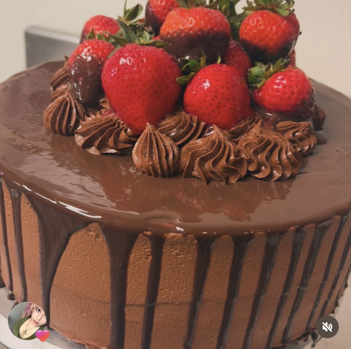 Chocolate strawberry celebration cake topped with fresh and chocolate-dipped strawberries