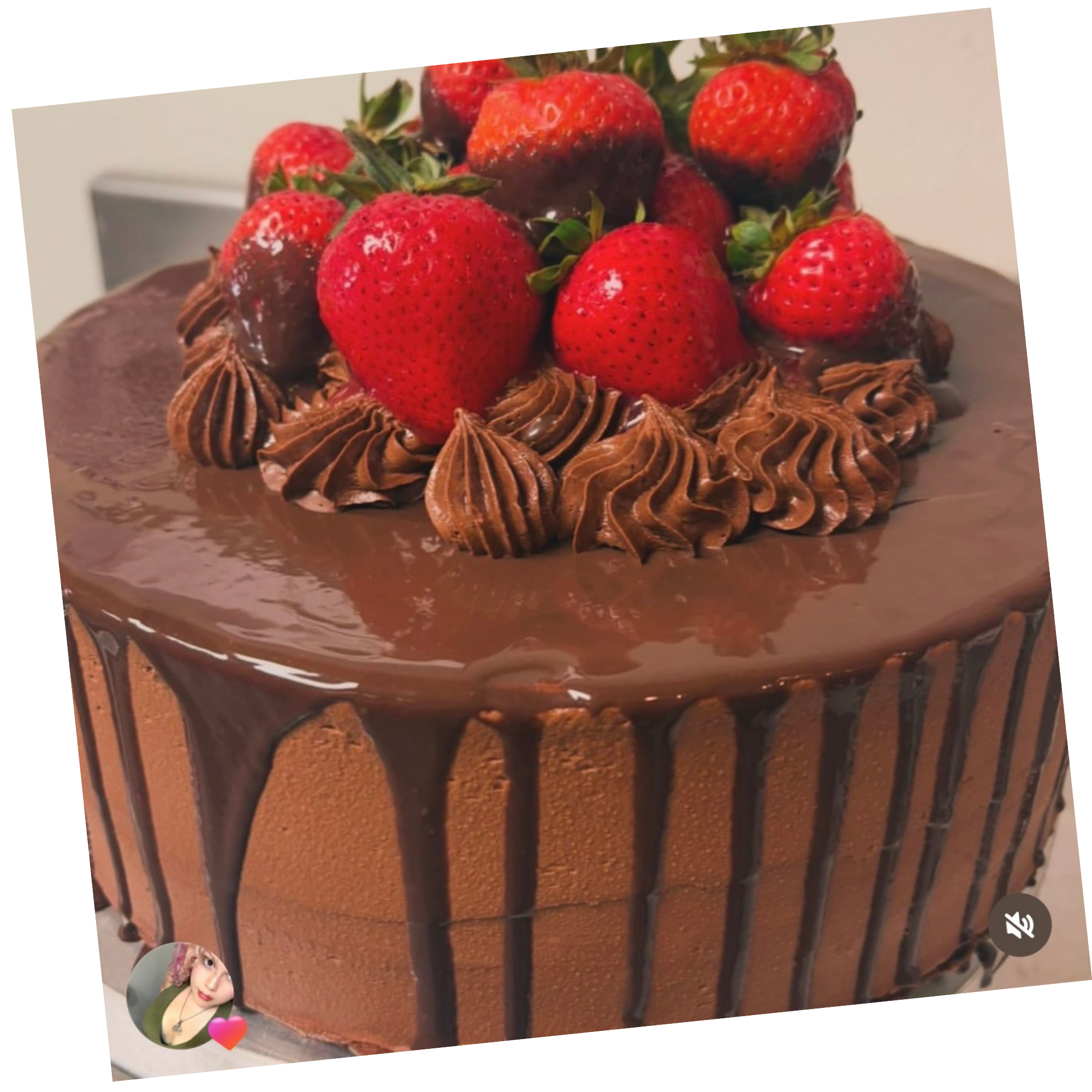 Chocolate strawberry celebration cake topped with fresh and chocolate-dipped strawberries