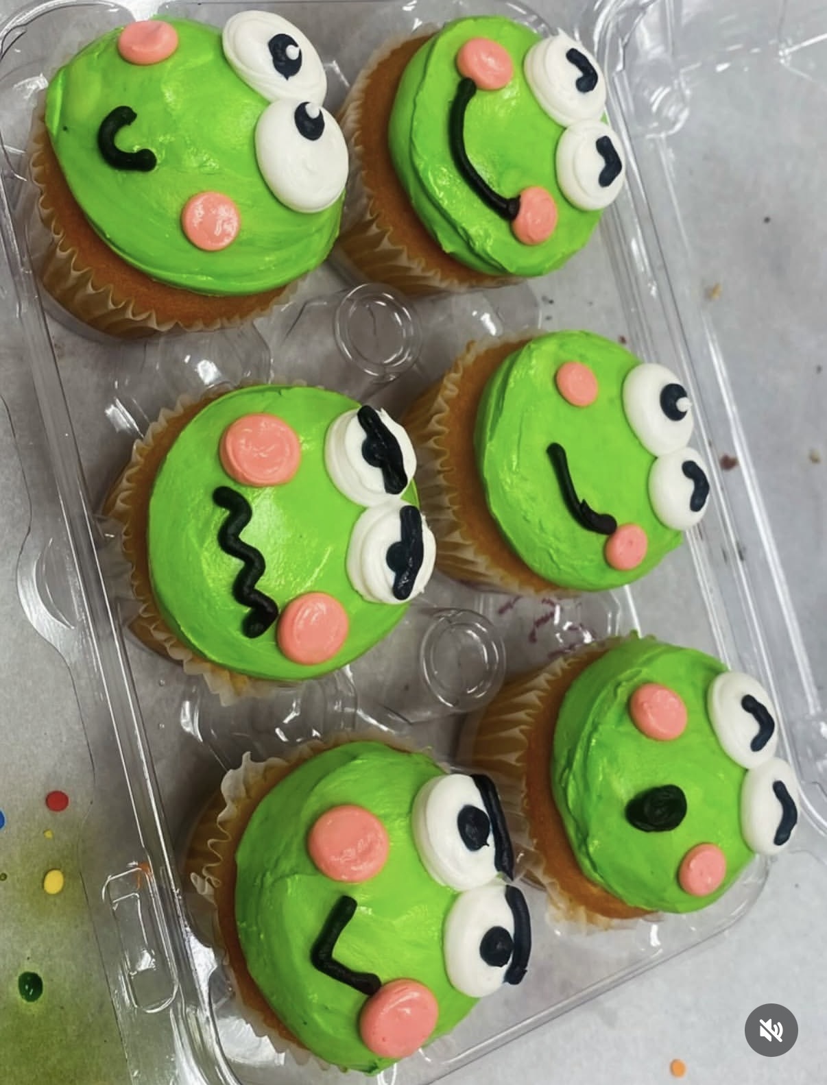 Frog character cupcakes with green frosting