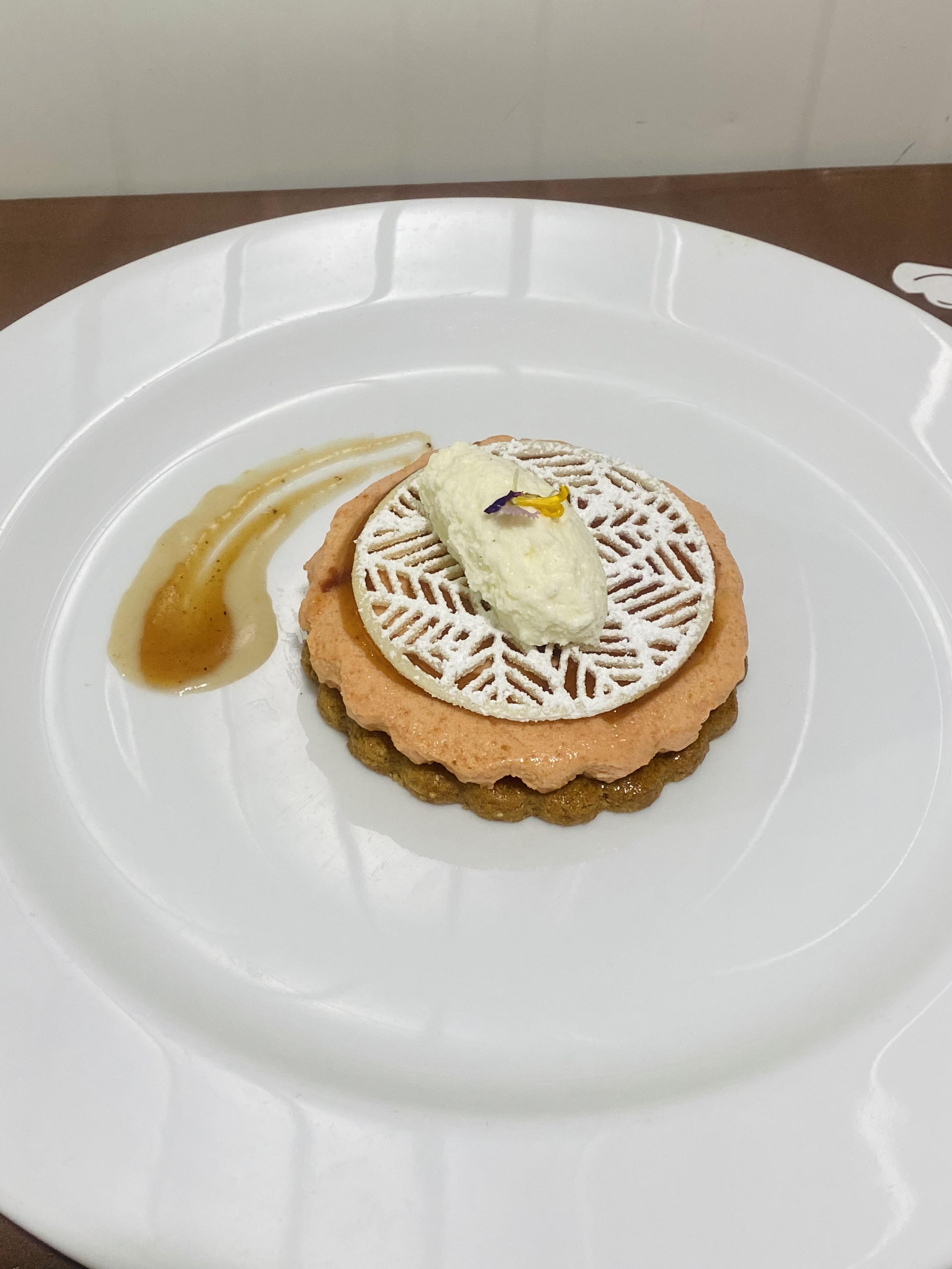 Plated fruit tart with cream